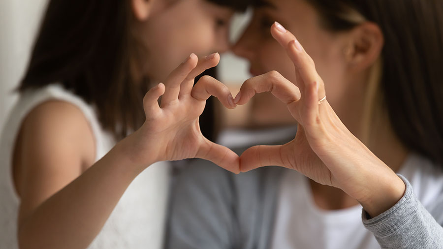 mother-and-child-make-heart-with-fingers-weight-loss-celebration